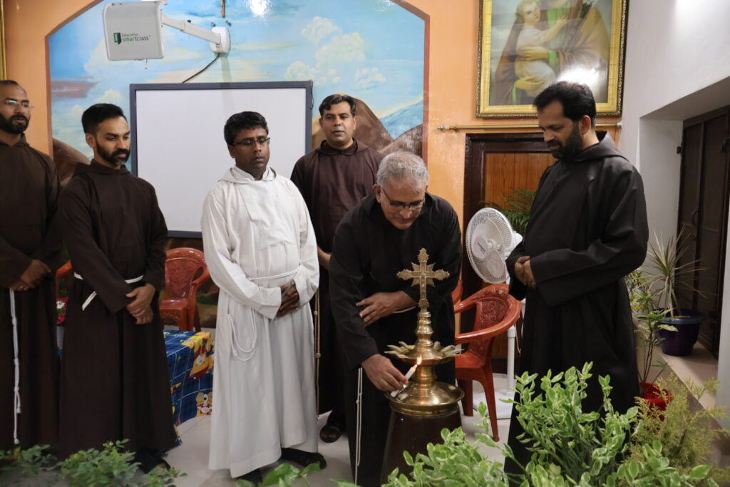 Br. Raphie Paliakara lighting the Indian lamp.